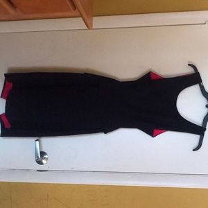 Black dress with pink interior, tight fitting,